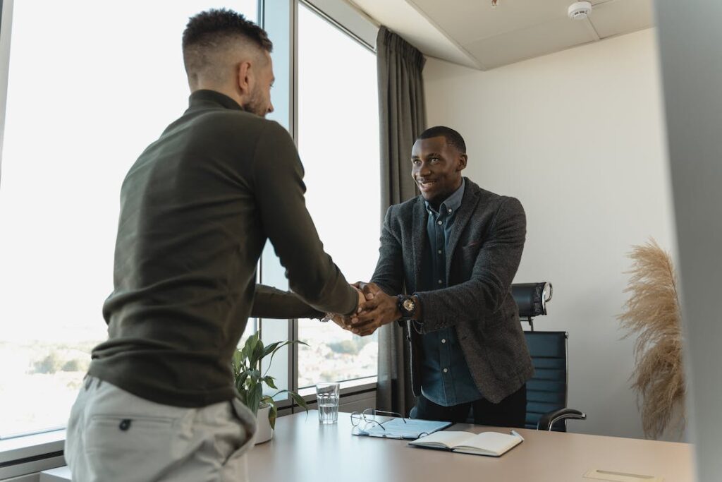 a private process server and lawyer shaking hands