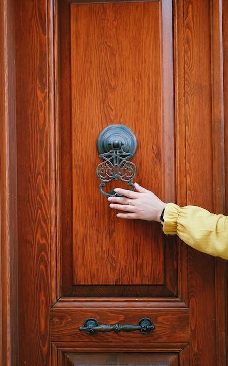 a process server knocking on a door