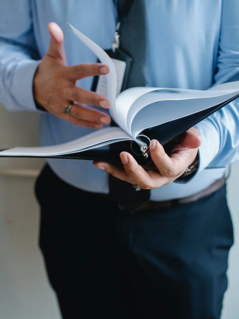 a certified process server reviewing documents