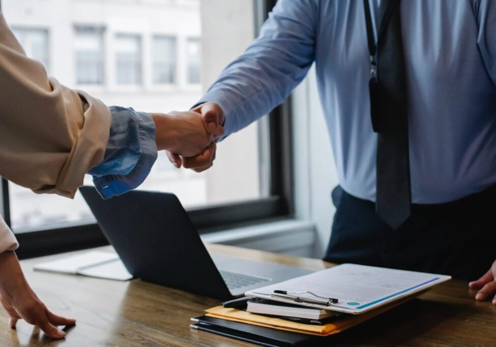 a certified process server shaking a lawyer's hand