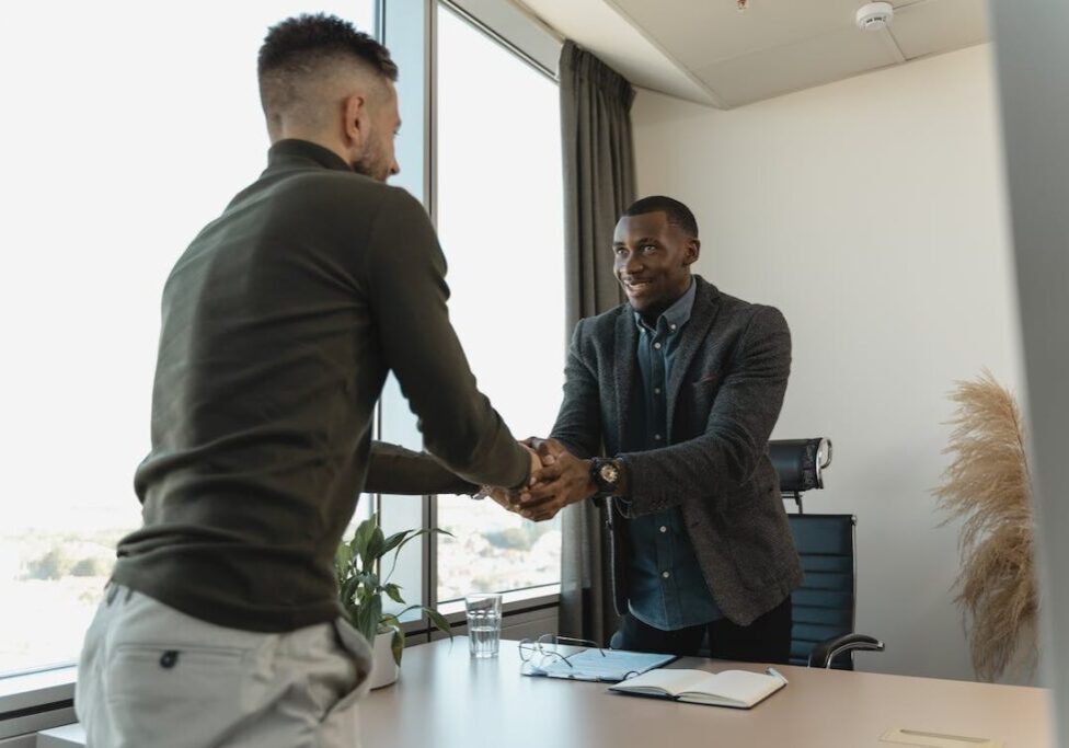 a private process server and lawyer shaking hands